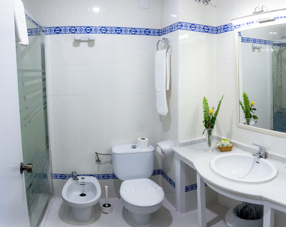 Double Room | Bathroom | Bathtub, free toiletries, hair dryer (on request), bidet
