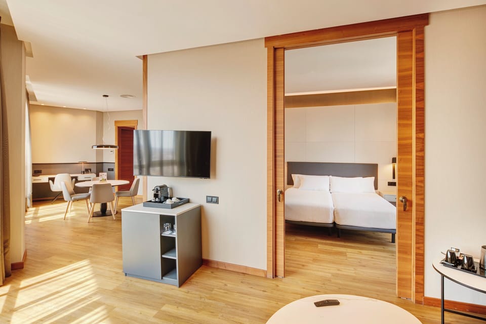 Premium bedding, down comforters, minibar, in-room safe