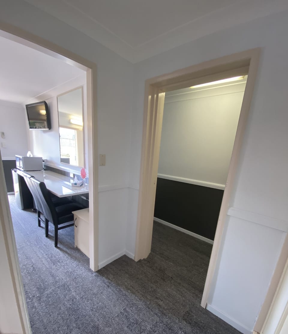2 Bedroom Unit (Downstairs) | Desk, iron/ironing board, WiFi (free), bed sheets