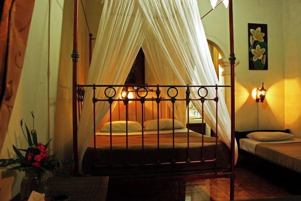 Colonial Style House | Desk, bed sheets