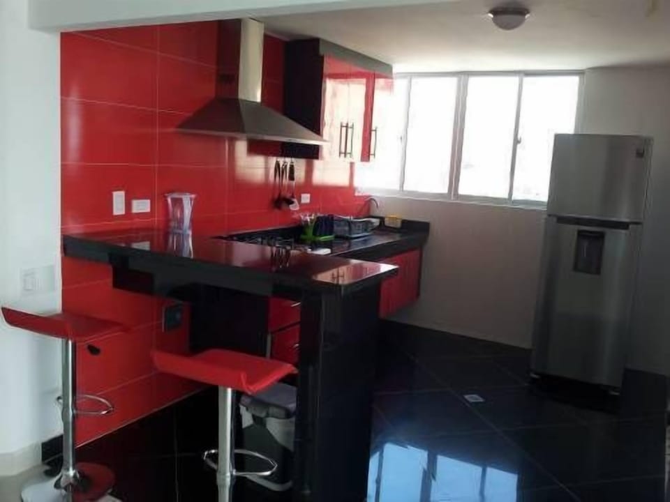 Apartment, 4 Bedrooms | Private kitchen | Full-size fridge, microwave, stovetop, cookware/dishes/utensils