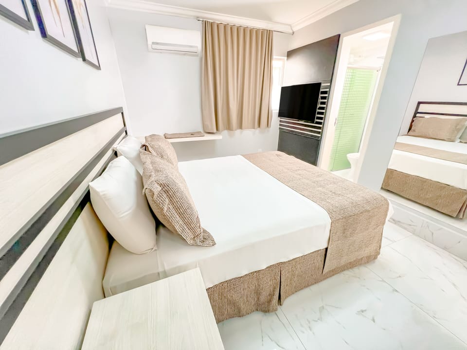 Standard Double Room | Minibar, in-room safe, desk, blackout drapes