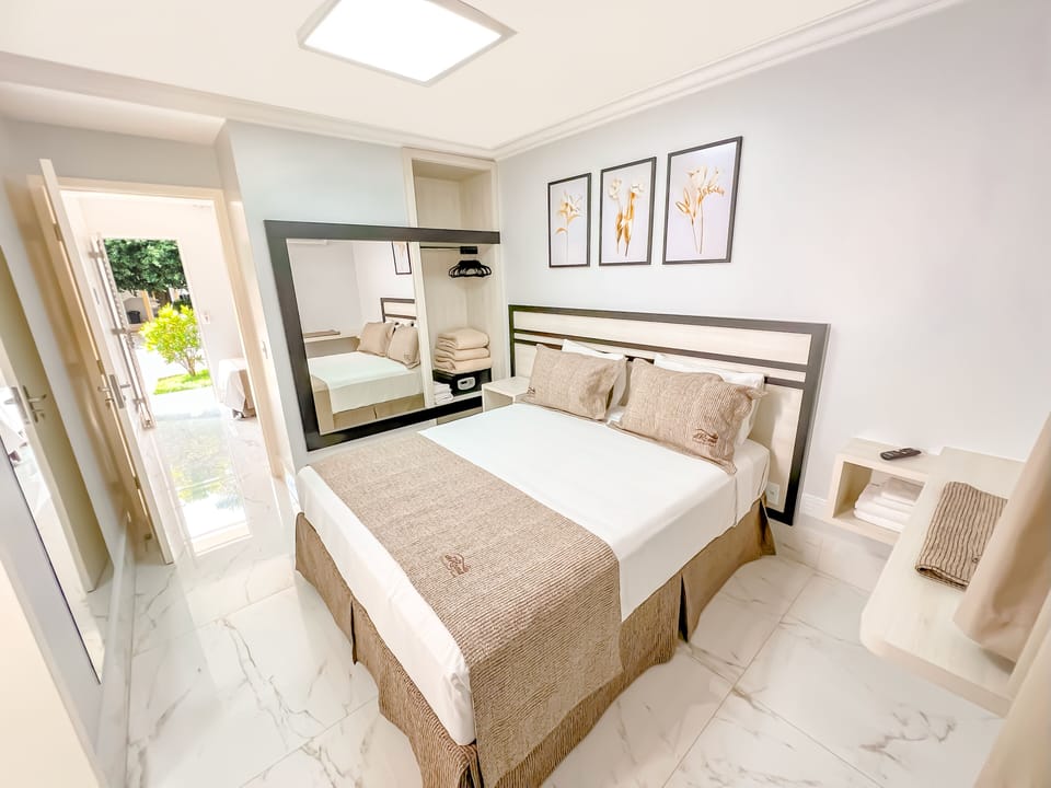 Standard Double Room | Minibar, in-room safe, desk, blackout drapes