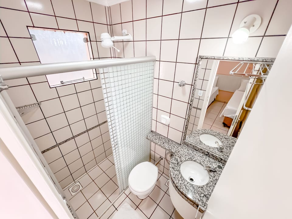 Standard Suite | Bathroom | Shower, towels, soap, toilet paper