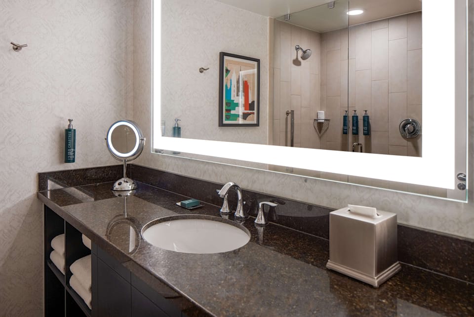 Designer toiletries, hair dryer, towels, soap