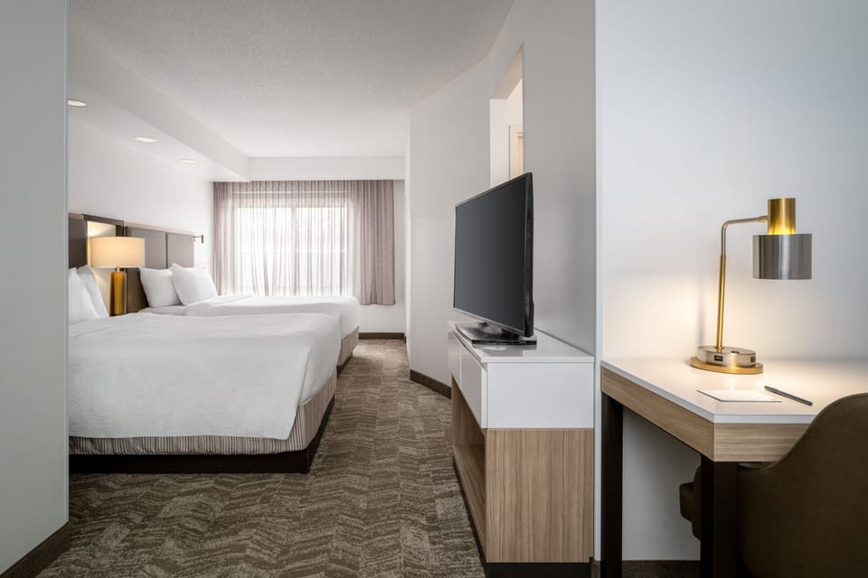 Suite, Multiple Beds | In-room safe, desk, laptop workspace, blackout drapes