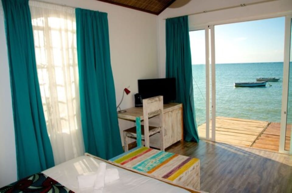 Panoramic Bungalow, Ocean View | Living area | Flat-screen TV