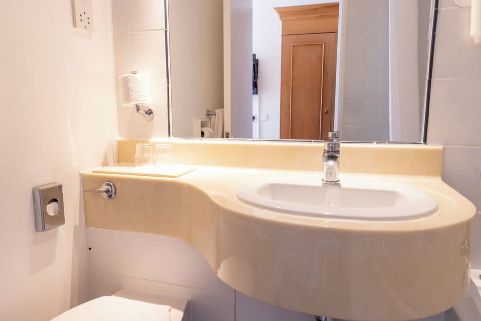 Twin Room | Bathroom | Hair dryer, towels