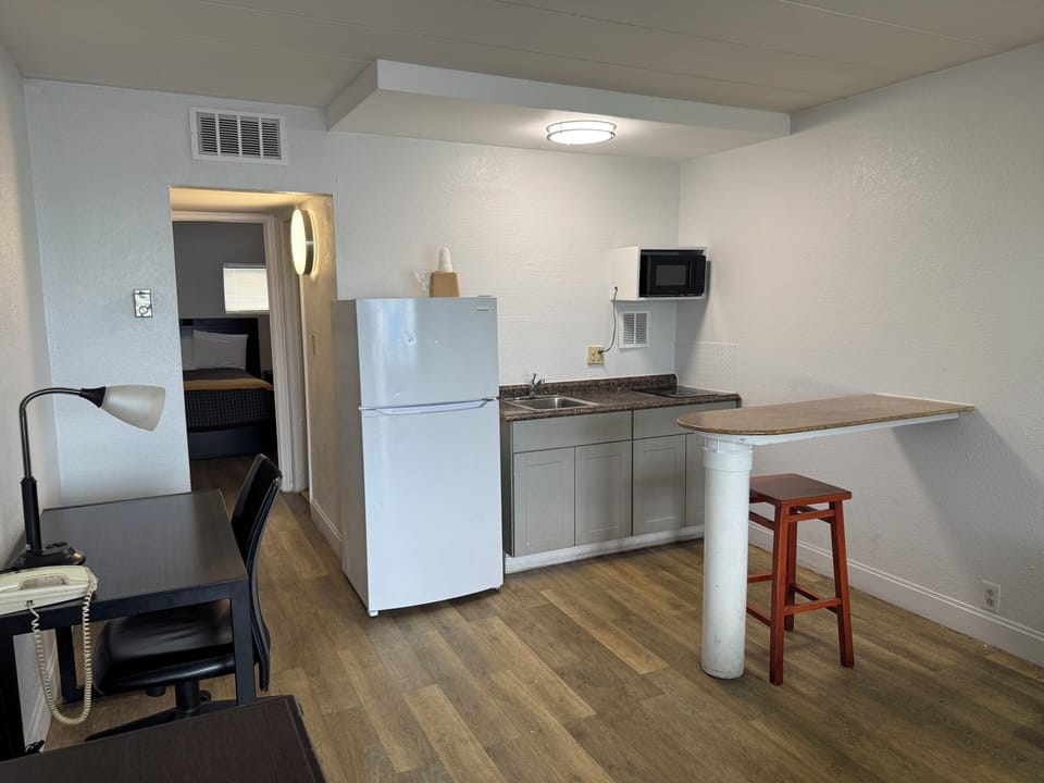 Two Room Suite with Kitchenette | 1 King & 1 Double Bed | Private kitchen | Fridge, microwave, stovetop