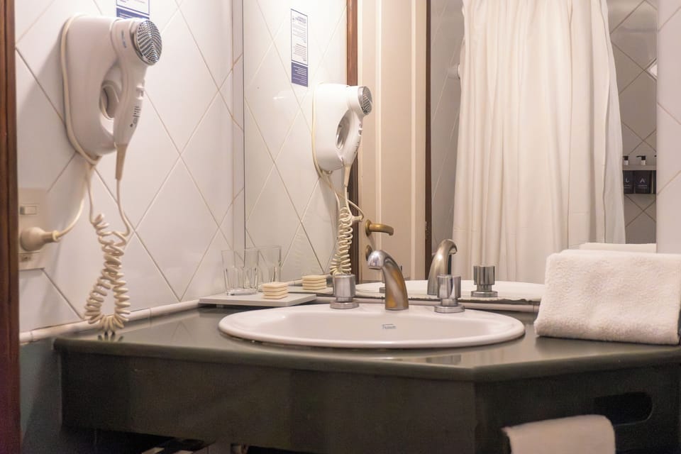 Combined shower/tub, hair dryer, towels, soap