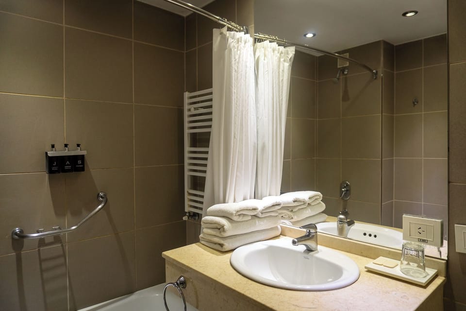 Combined shower/tub, hair dryer, towels, soap
