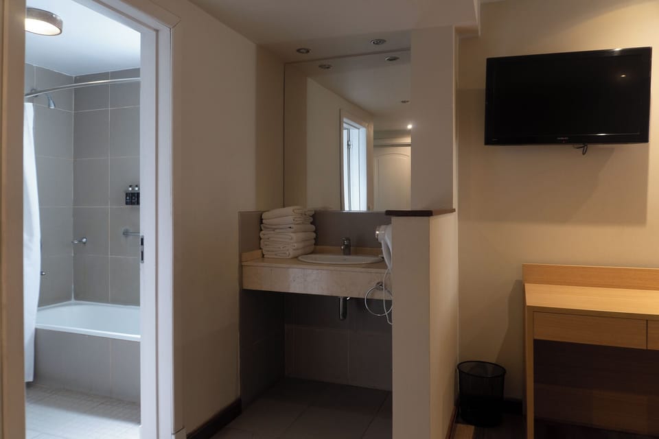 Classic Quadruple Room | Bathroom | Combined shower/tub, hair dryer, towels, soap