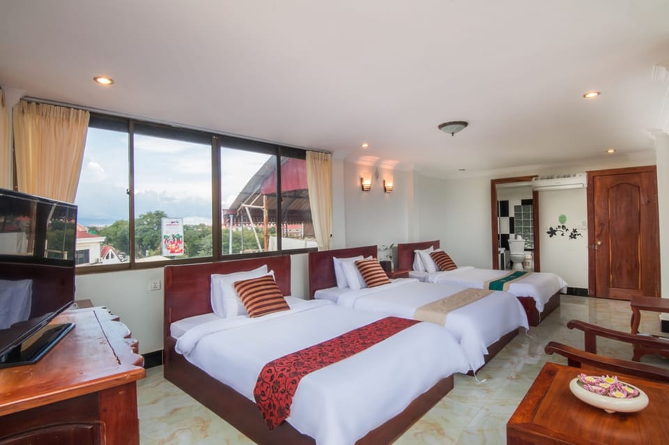 Superior Triple Room, City View | Minibar, desk, iron/ironing board, rollaway beds