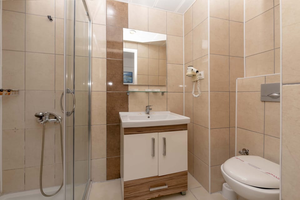 Shower, free toiletries, hair dryer, slippers