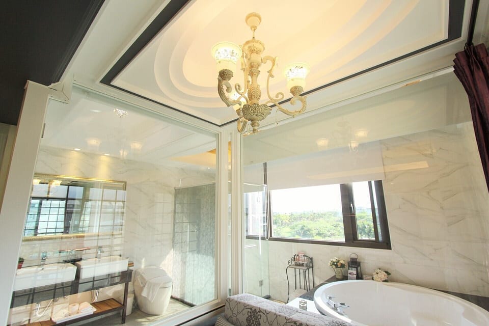 Luxury Double Room, 1 King Bed, Hot Tub, City View | Bathroom | Shower, designer toiletries, hair dryer, slippers