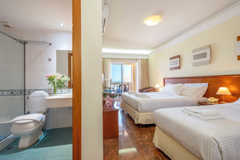 Superior Triple Room, Sea View | In-room safe, blackout drapes, soundproofing, free cribs/infant beds