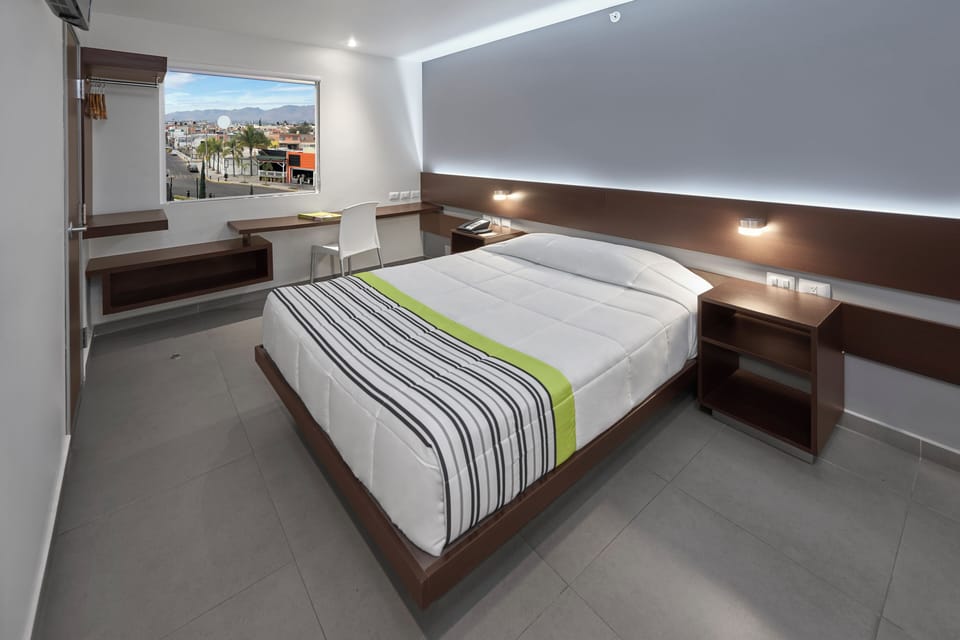 Room, 1 Queen Bed | Desk, blackout drapes, iron/ironing board, free WiFi
