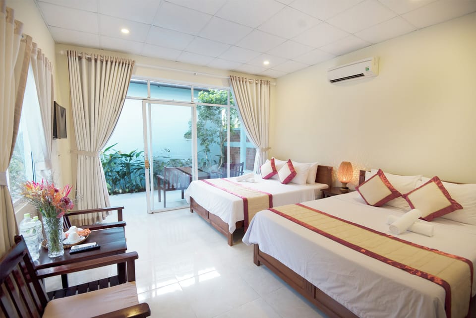 Family Bungalow, Garden View | Minibar, in-room safe, individually decorated, individually furnished