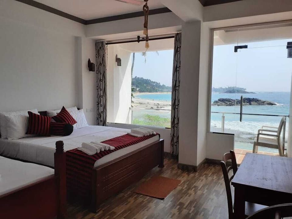 Superior Triple Room, 1 Bedroom, Sea View, Beachfront | Premium bedding, desk, laptop workspace