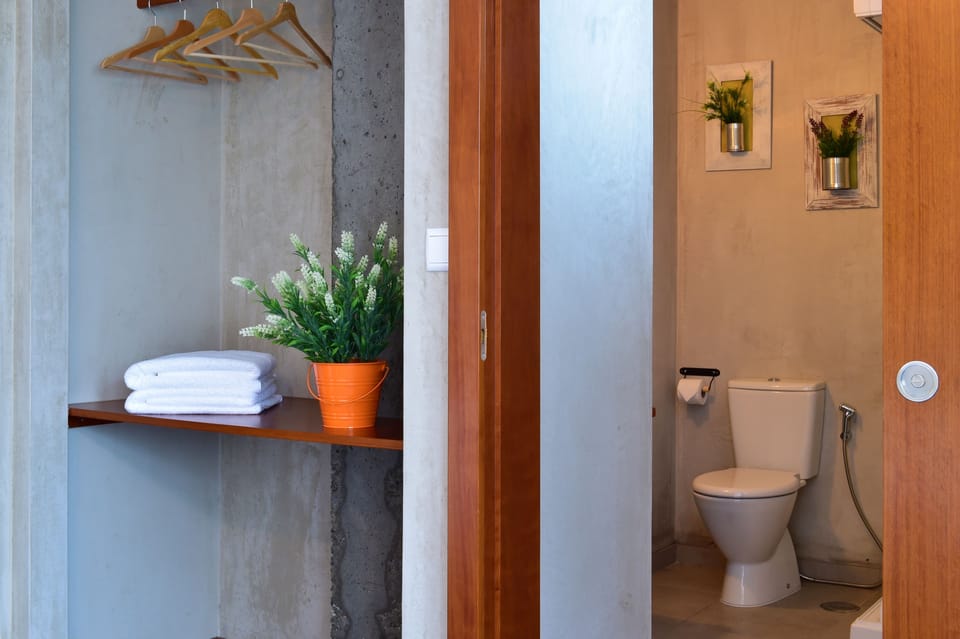 Shower, designer toiletries, hair dryer, towels