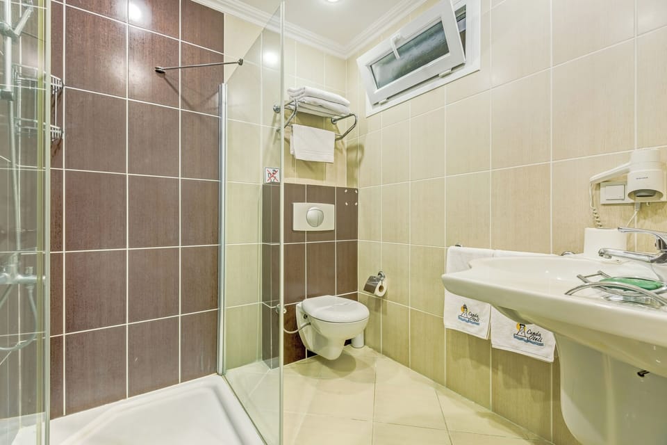 Shower, free toiletries, hair dryer, slippers
