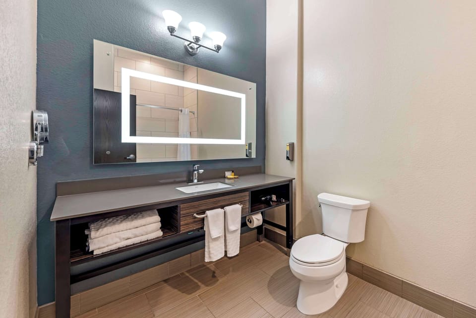 Suite, 2 Queen Beds, Non Smoking (with Sofabed) | Bathroom | Free toiletries, hair dryer, towels, soap
