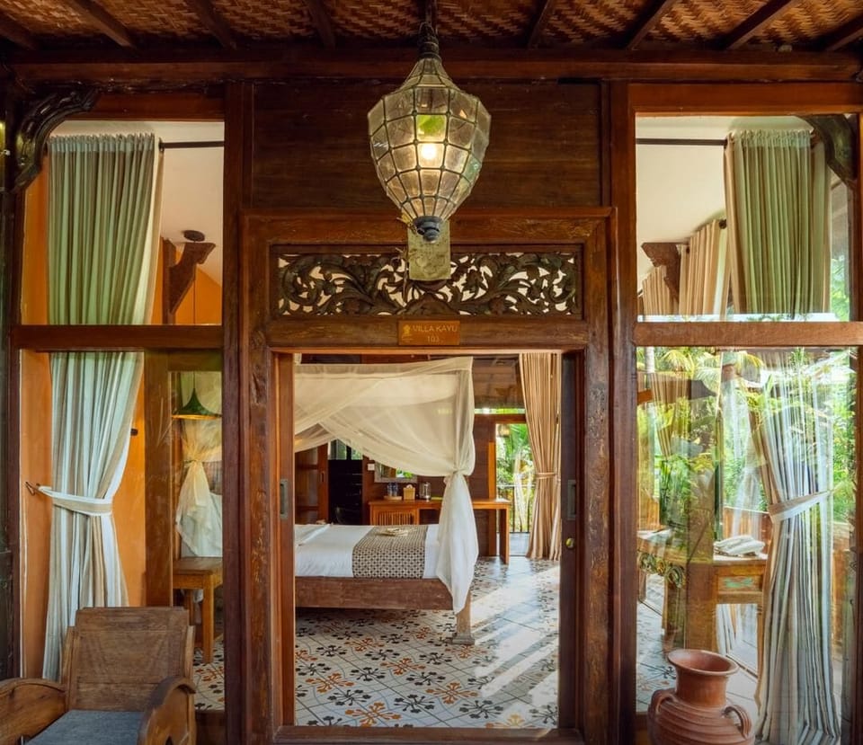 Deluxe Suite, Kitchen, Pool View | Minibar, in-room safe, individually decorated, individually furnished