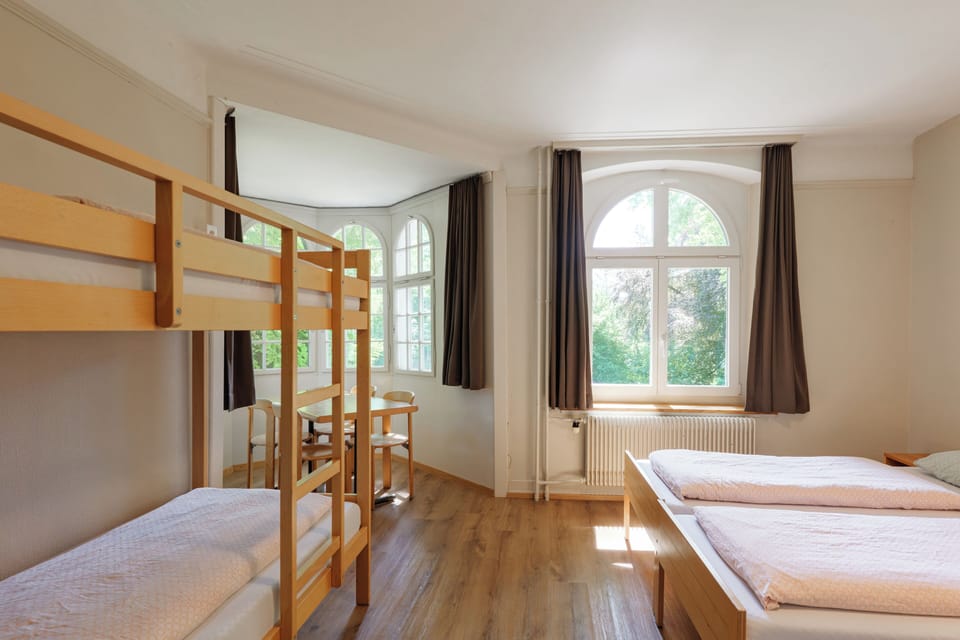 Family Room | Desk, bed sheets