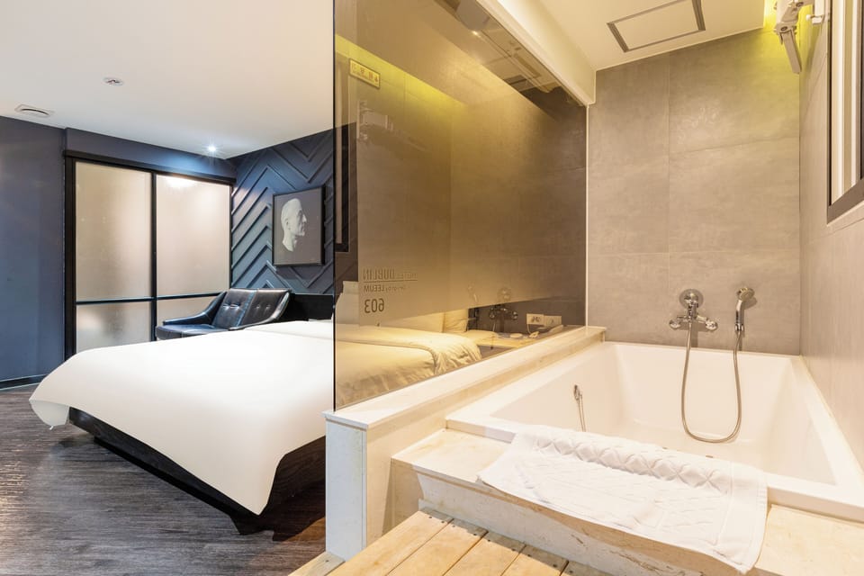 Double Room | Bathroom | Deep soaking tub, hydromassage showerhead, hair dryer, bathrobes