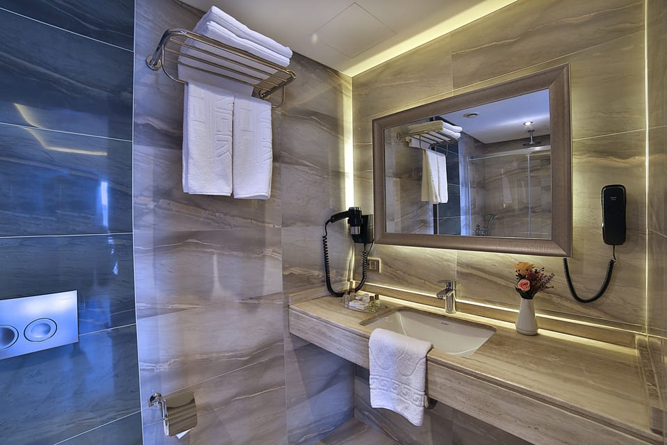 Shower, free toiletries, hair dryer, slippers