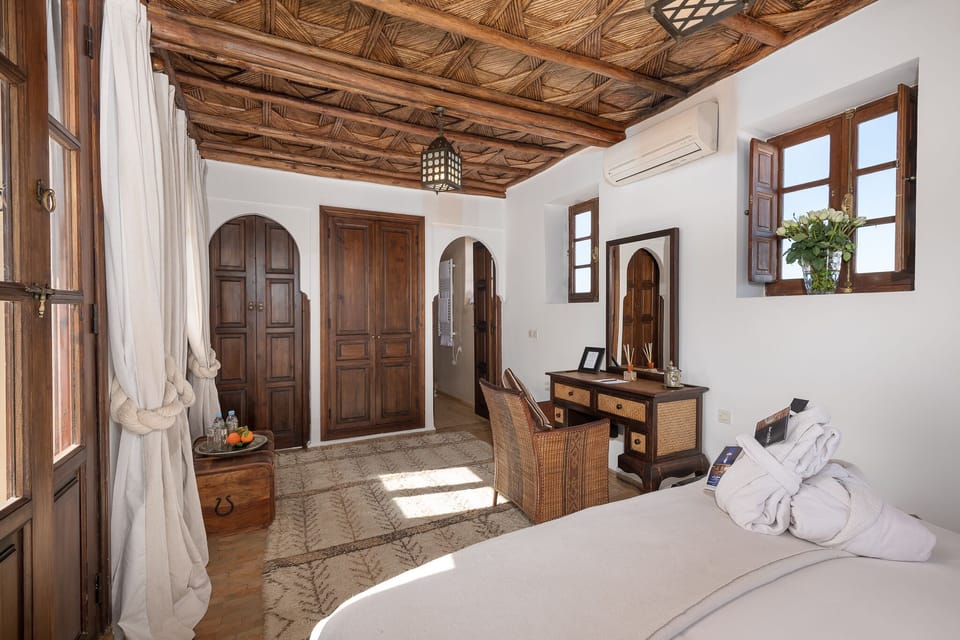 Deluxe Room, Terrace | Minibar, in-room safe, soundproofing, iron/ironing board