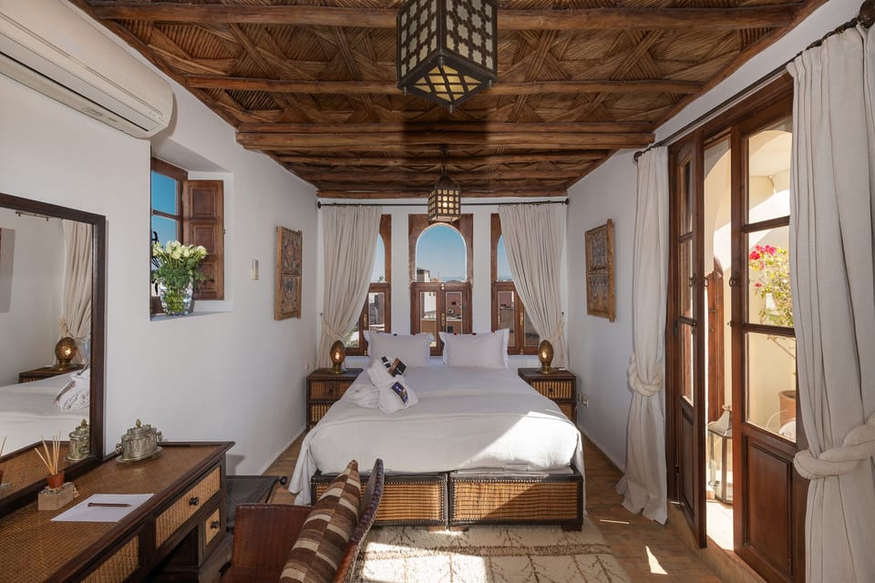 Deluxe Room, Terrace | Minibar, in-room safe, soundproofing, iron/ironing board