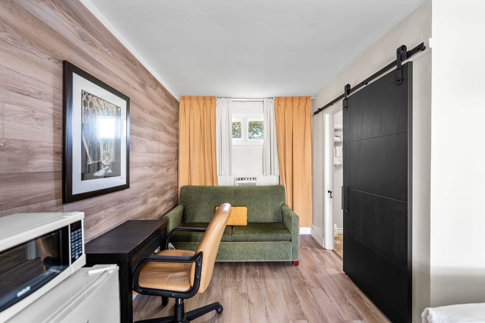 Economy Room, 2 Double Beds | Living area | Flat-screen TV
