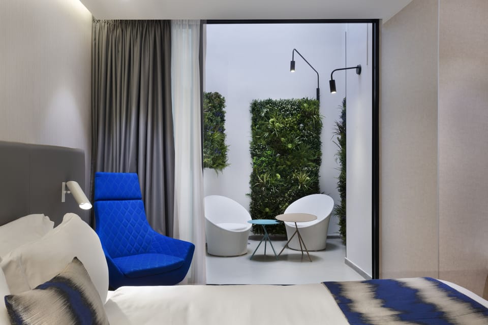 Deluxe Room, Patio | Premium bedding, in-room safe, desk, soundproofing