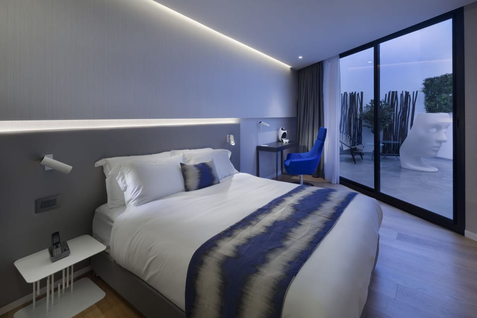Superior Room with Shared Patio | Premium bedding, in-room safe, desk, soundproofing