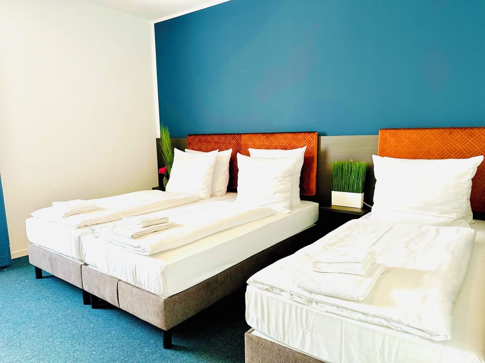 Triple Room | Hypo-allergenic bedding, minibar, desk, laptop workspace