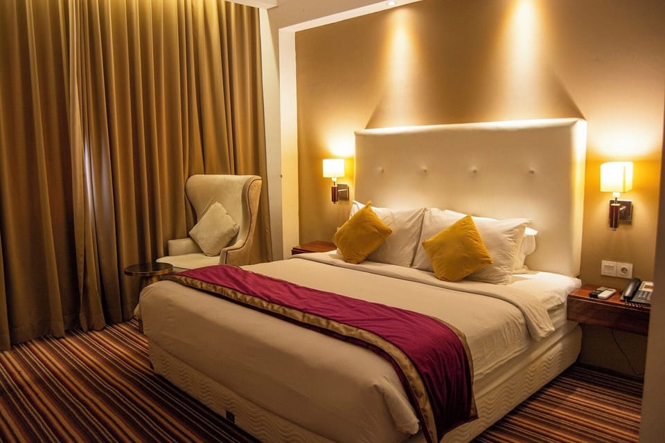 Deluxe Double Room | Minibar, desk, laptop workspace, blackout drapes