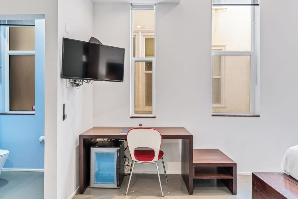 Standard Room, 1 King Bed, Private Bathroom (Self check-in) | Desk, laptop workspace, blackout drapes, iron/ironing board
