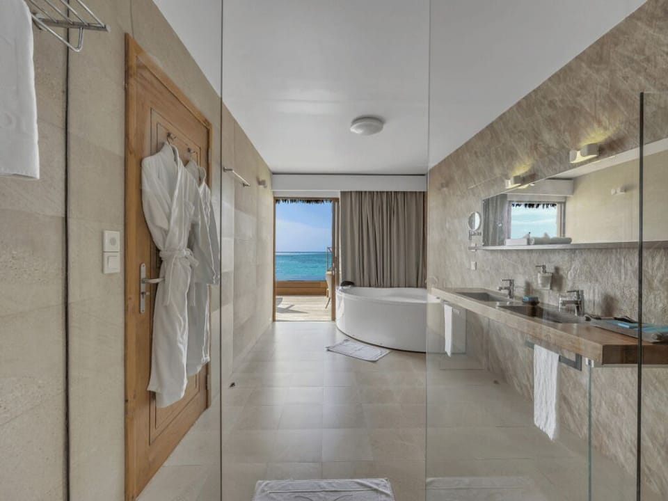 Lagoon Suite with Pool​ | Bathroom | Shower, rainfall showerhead, eco-friendly toiletries, hair dryer