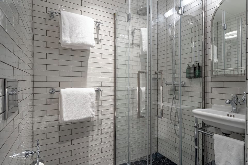 Junior Suite, Non Smoking | Bathroom | Shower, hair dryer, bathrobes, slippers