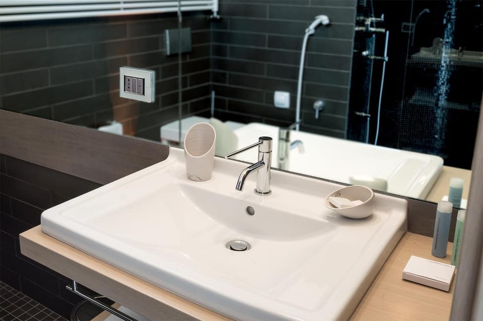 Shower, free toiletries, hair dryer, slippers