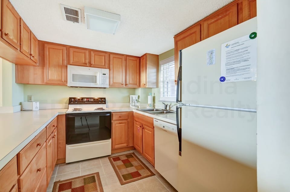 Condo, 2 Bedrooms | Private kitchen | Full-size fridge, microwave, oven, stovetop