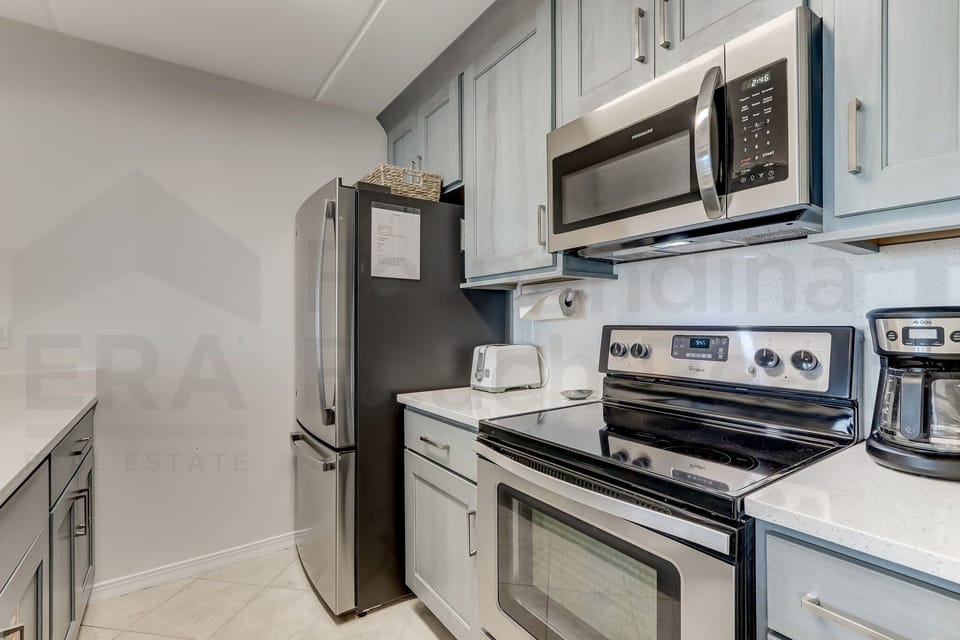 Condo, 2 Bedrooms | Private kitchen | Full-size fridge, microwave, oven, stovetop