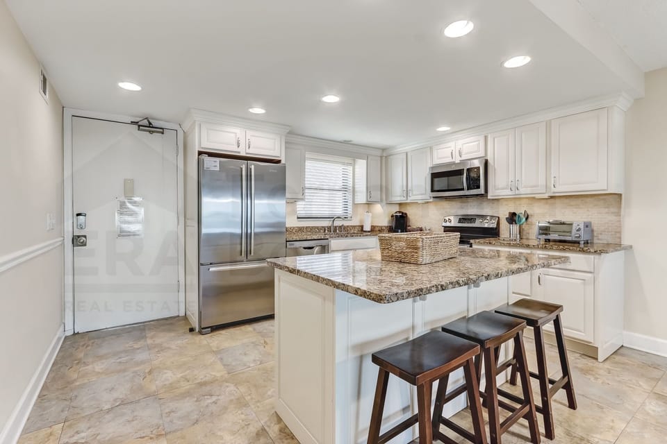 Condo, 2 Bedrooms | Private kitchen | Full-size fridge, microwave, oven, stovetop
