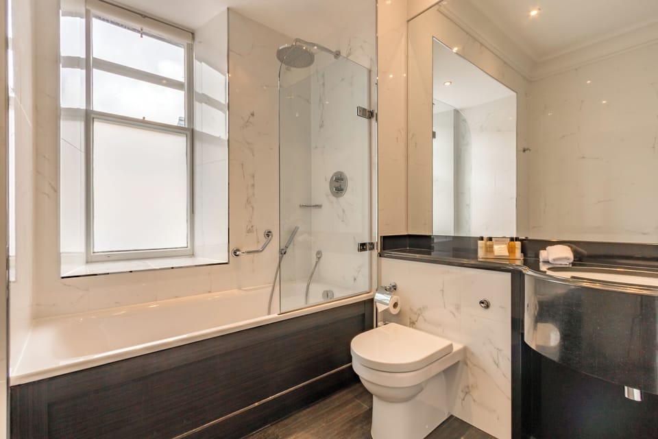 Designer toiletries, hair dryer, bathrobes, towels