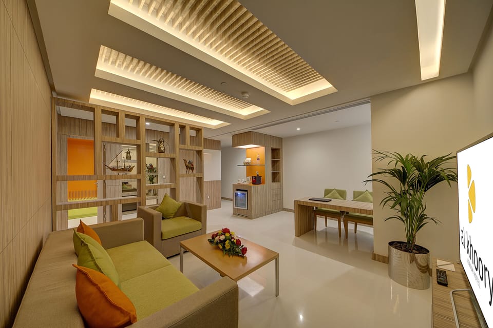 Executive Suite, 1 King Bed | Living room | 22-inch LED TV with satellite channels, TV