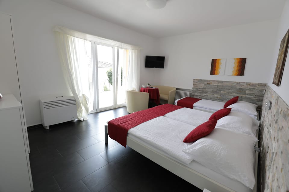 Triple Room, Lake View | In-room safe, free cribs/infant beds, rollaway beds, free WiFi