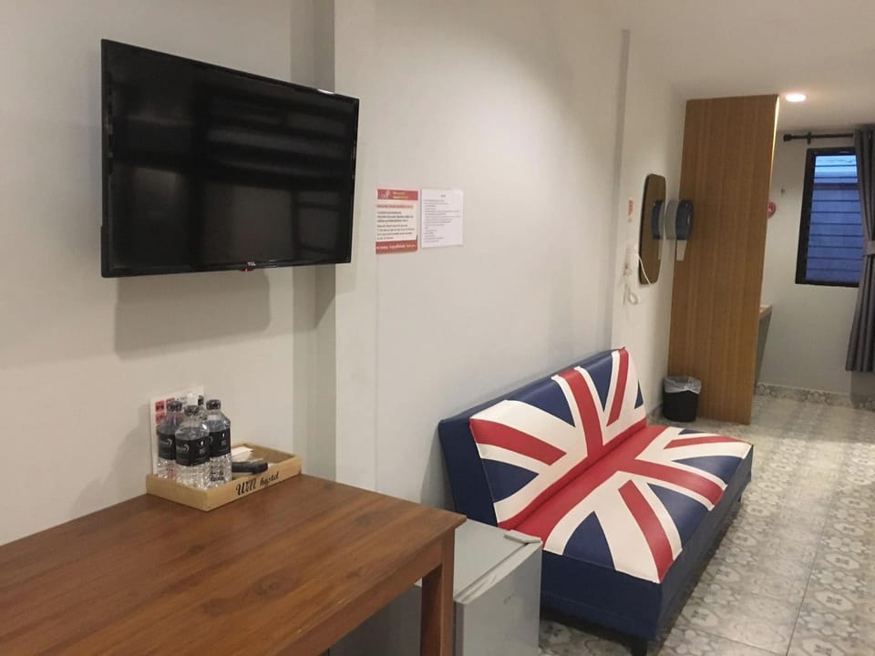 Family Room | Desk, laptop workspace, blackout drapes, iron/ironing board