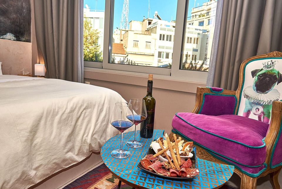 Deluxe Athenian Suite | Premium bedding, minibar, in-room safe, blackout drapes