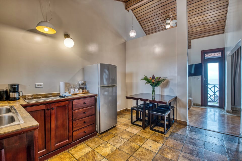 Luxury Suite, 1 King Bed, Sea View | Private kitchen | Coffee/tea maker, freezer
